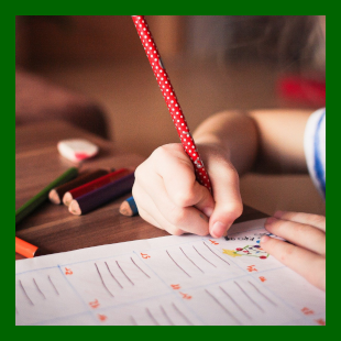 Green Box with Child Writing