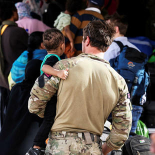 A person carrying a child
