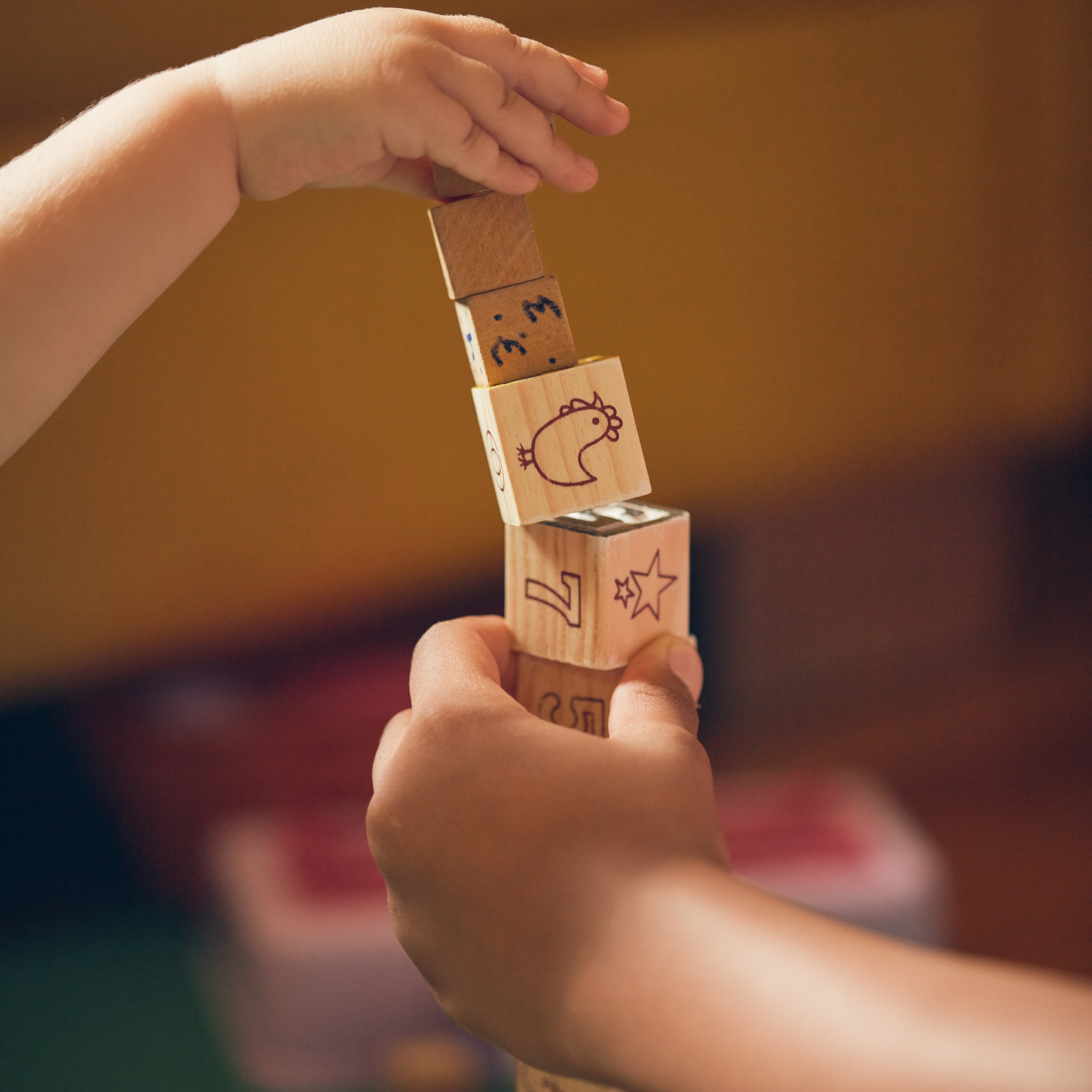 Children playing with educational wooden blocks
