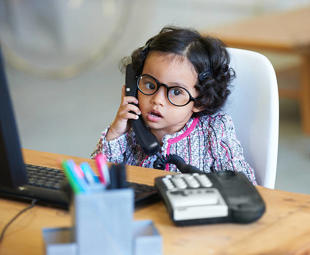A child using a telephone