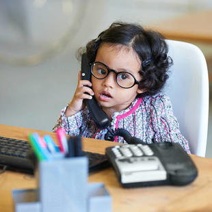 A child using a telephone