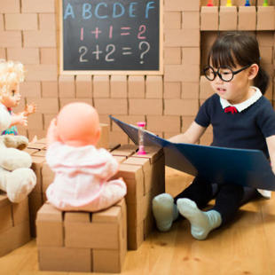 Child role-playing as a teacher