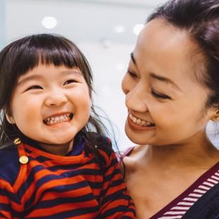 A person and a child laughing