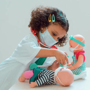 Child role-playing as a doctor
