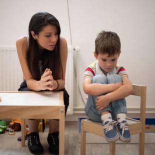 Adult talking with upset child