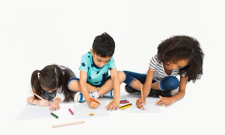 A group of children drawing on a piece of paper