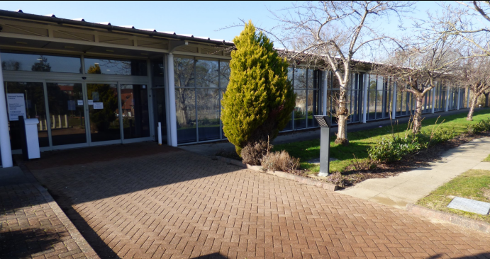 A building with a brick walkway.