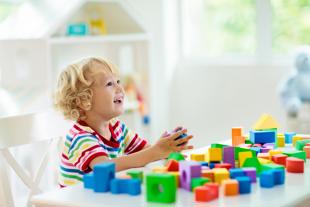 A child playing with colourful blocks