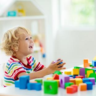 A child playing with colourful blocks