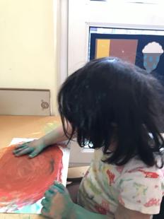A child painting on a paper