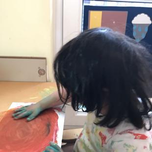 A child painting on a paper