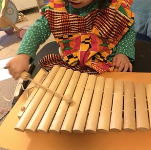 A child playing a xylophone