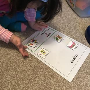A child playing with a paper