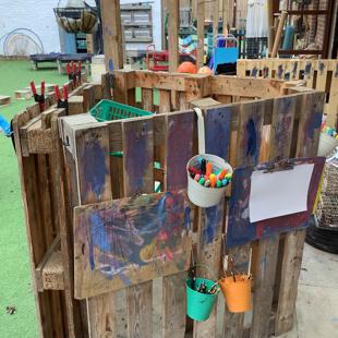 A wooden pallet with paint on it