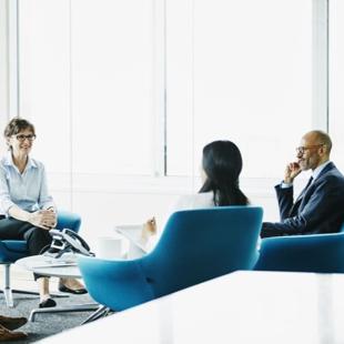 People sitting on blue chairs
