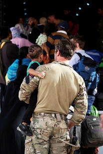 A person carrying a child