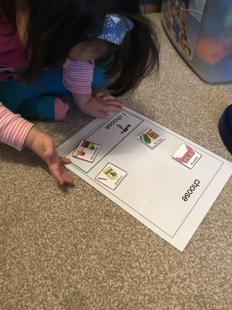 A child playing with a paper
