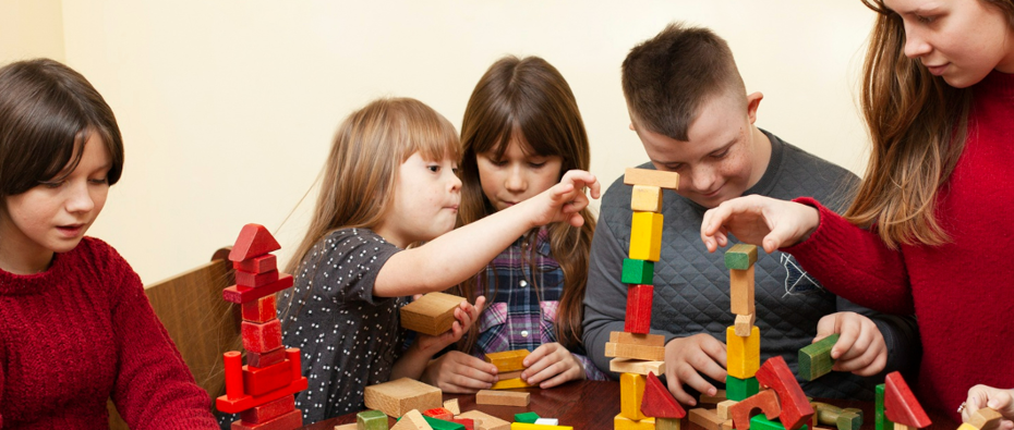 Children Playing with Colourful Blocks
