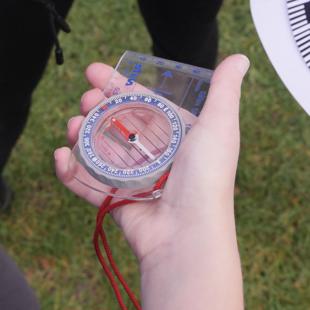 Compass in a hand