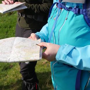 walker holding a map